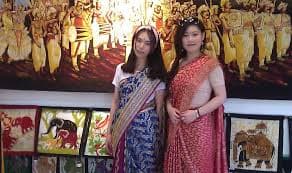 Tourist learning batik